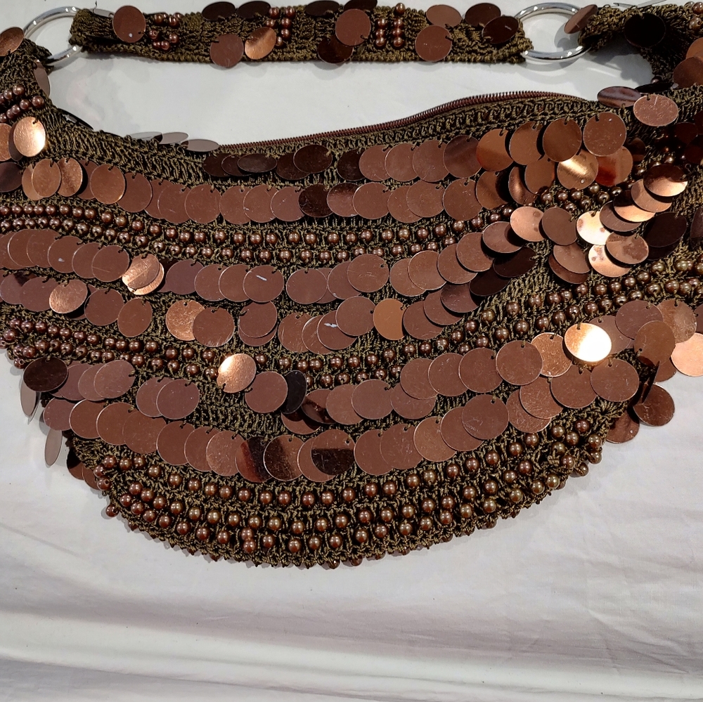 A Nicole Lee vintage copper shoulder bag.
